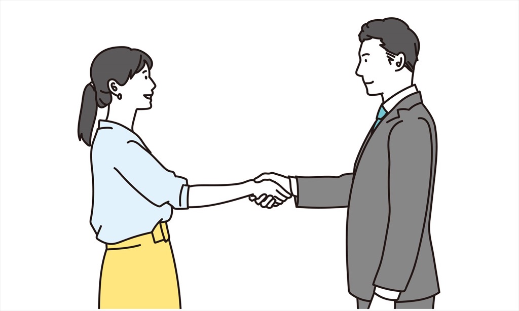 男女で手を取り合う画像